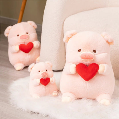 Cerdito de peluche sosteniendo un corazón de San Valentín, 8-16" | 20-40 centímetros